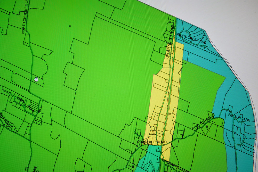 A portion of the Town of Lloyd zoning map showing the Light Industrial section along Upper North Road in yellow and the large proposed Falcon Ridge site in green to the immediate left.